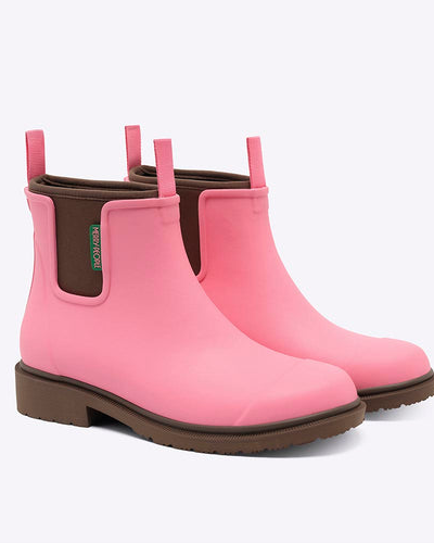 pink chelsea rainboots against white background