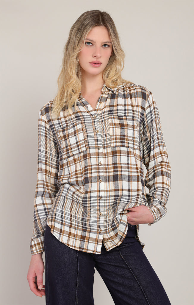 woman in plaid shirt and jeans with white background