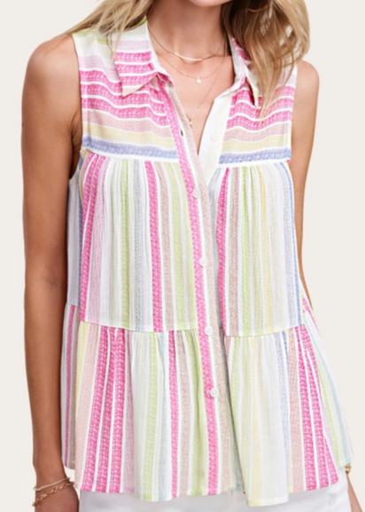 Woman wearing a colorful striped sleeveless top and hat on a plain background