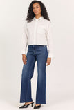 woman in white cropped blouse with rhinestones on the collar against white background