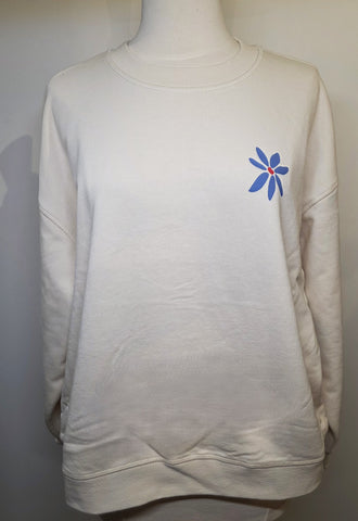 White sweatshirt with a blue and red flower design on a mannequin against a white background