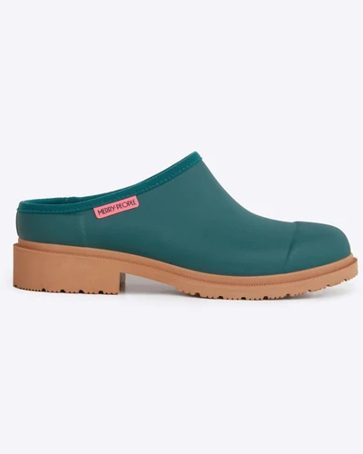 side view of teal clog against white background