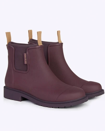 maroon chelsea rainboots against white background