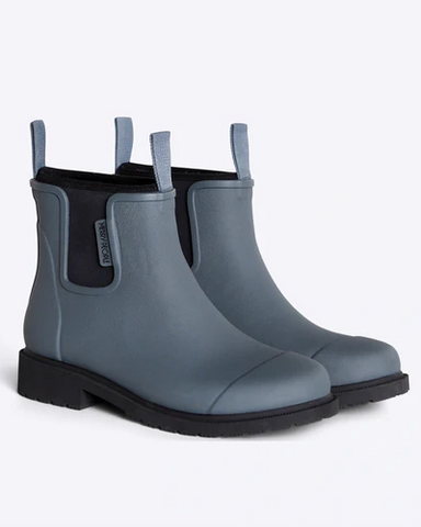 grey chelsea rainboots against white background