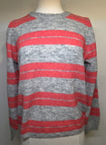 Red and gray striped sweater on a mannequin against a plain background