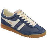 Blue sneaker with white laces and sole on a white background