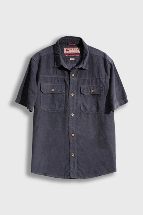 Navy short-sleeve shirt with button details on a light gray background
