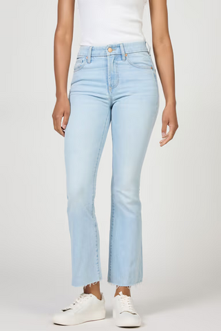 Light blue jeans worn by a person on a white background