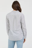 Person wearing a striped shirt and light blue jeans on a white background