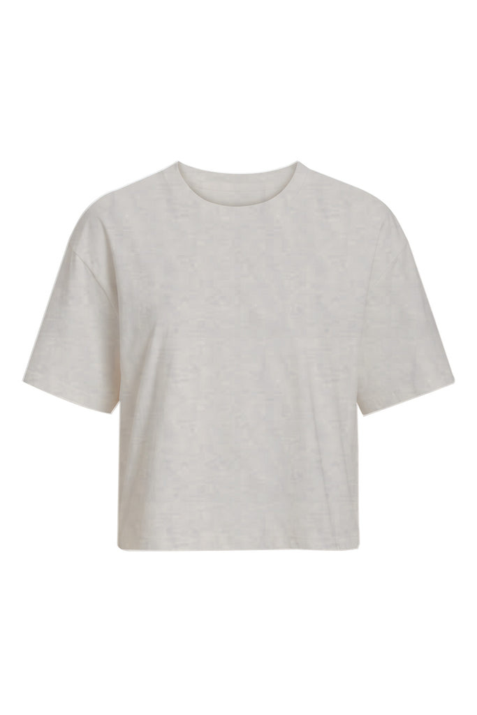 A light beige short-sleeve crewneck t-shirt with a relaxed, cropped fit, shown against a plain white background.