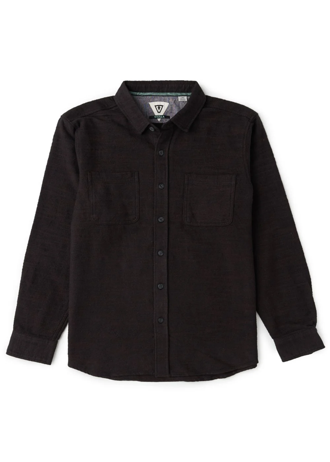 A black long-sleeve button-up shirt with two chest pockets, laid flat against a white background.