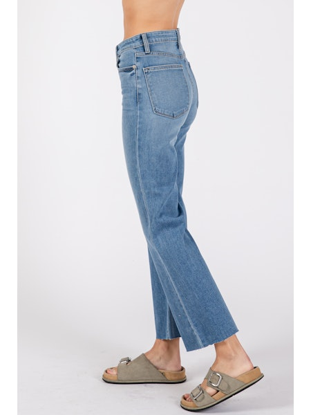 Light blue jeans worn by a person on a white background