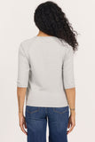 back of woman in grey, 3/4 sleeve top and jeans