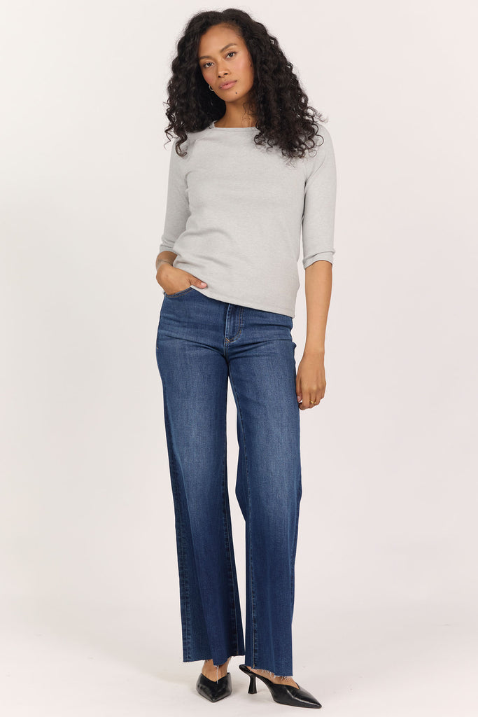 woman in grey, 3/4 sleeve top and jeans